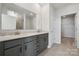 Bathroom with gray double vanity, quartz countertop and walk-in shower at 4455 Reed Creek Dr # 102, Sherrills Ford, NC 28673