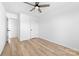 Bright bedroom featuring a ceiling fan, natural light, and wood-look floors at 613 Buffalo St, Shelby, NC 28150