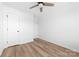 Bright bedroom featuring a ceiling fan, natural light, and wood-look floors at 613 Buffalo St, Shelby, NC 28150