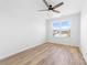 Bright bedroom featuring a ceiling fan, natural light, and wood-look floors at 613 Buffalo St, Shelby, NC 28150