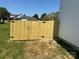New wooden privacy fence surrounding the perimeter of the back yard at 613 Buffalo St, Shelby, NC 28150