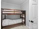Neutral-toned bedroom featuring a rustic wooden bunk bed with stylish bedding and a simple, clean aesthetic at 724 Finley Rd, Rock Hill, SC 29730