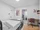 Comfortable bedroom with hardwood floors, a cozy bed, and a view into the adjacent room at 724 Finley Rd, Rock Hill, SC 29730
