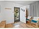 Welcoming entryway with a decorated front door, wood floors, and comfortable seating at 724 Finley Rd, Rock Hill, SC 29730