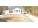 Charming single-story home with a detached garage and a well-manicured lawn at 724 Finley Rd, Rock Hill, SC 29730