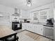 Bright eat-in kitchen featuring white cabinets, stainless steel appliances, and modern countertops at 724 Finley Rd, Rock Hill, SC 29730