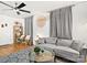 Stylish living room with hardwood floors, a ceiling fan, and modern decor at 724 Finley Rd, Rock Hill, SC 29730