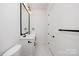 Stylish bathroom with a double vanity and large mirror at 10614 Arlington Church Rd, Charlotte, NC 28227