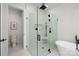 Modern bathroom with a walk-in shower and separate toilet area at 10614 Arlington Church Rd, Charlotte, NC 28227