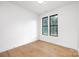 Spacious bedroom with light hardwood floors and large windows at 10614 Arlington Church Rd, Charlotte, NC 28227