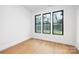 Spacious bedroom with light hardwood floors and large windows at 10614 Arlington Church Rd, Charlotte, NC 28227