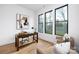 Modern home office featuring a wooden desk and comfortable armchairs at 10614 Arlington Church Rd, Charlotte, NC 28227