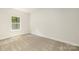 Simple bedroom with carpeted floor and a window at 108 Elwood St, Kannapolis, NC 28081