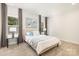 Bright bedroom with a cozy bed and soft color palette at 108 Elwood St, Kannapolis, NC 28081