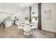 Modern dining area with white chairs and a round table at 108 Elwood St, Kannapolis, NC 28081