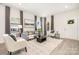 Bright and airy living room with gray sofa and wood coffee table at 108 Elwood St, Kannapolis, NC 28081