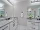 Bathroom featuring dual vanities, granite countertops, and contemporary fixtures at 1304 Pleasant Plains Rd, Matthews, NC 28105