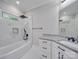 Modern bathroom featuring a bathtub, white cabinets, and granite countertops at 1304 Pleasant Plains Rd, Matthews, NC 28105
