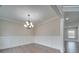 Spacious dining room featuring modern wainscotting, hardwood floors, and elegant lighting fixtures perfect for entertaining at 1304 Pleasant Plains Rd, Matthews, NC 28105