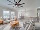 Inviting living room with comfortable seating, large windows, and a neutral color palette at 1304 Pleasant Plains Rd, Matthews, NC 28105