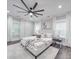 Spacious main bedroom boasts wood floors, decorative lighting, and large windows at 1304 Pleasant Plains Rd, Matthews, NC 28105
