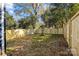 Fenced backyard with young tree and plenty of space at 137 S Smallwood Pl, Charlotte, NC 28208