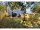 Landscaped backyard with a young tree and privacy fence at 137 S Smallwood Pl, Charlotte, NC 28208