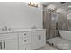 Modern bathroom with double vanity, soaking tub, and glass shower at 137 S Smallwood Pl, Charlotte, NC 28208