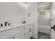 Double vanity bathroom with modern fixtures and a view into the shower at 137 S Smallwood Pl, Charlotte, NC 28208