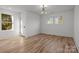 Bright bedroom with hardwood floors and large windows offering natural light at 137 S Smallwood Pl, Charlotte, NC 28208