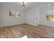 Bright bedroom with hardwood floors and large windows offering natural light at 137 S Smallwood Pl, Charlotte, NC 28208