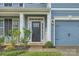 Inviting front entrance with dark door and welcoming sign at 137 Yellow Birch Loop, Mooresville, NC 28117