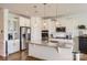 Modern kitchen boasts stainless steel appliances and a spacious island at 137 Yellow Birch Loop, Mooresville, NC 28117