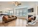 Living area with hardwood floors, fireplace, and a view of the backyard at 137 Yellow Birch Loop, Mooresville, NC 28117