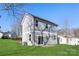 Gray sided two-story home with a back patio and grassy backyard at 1823 Bristol Rd, Statesville, NC 28677