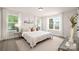 Bright bedroom featuring a king-size bed and ample natural light at 1823 Bristol Rd, Statesville, NC 28677