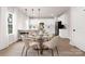 Modern dining area with glass table and four chairs near kitchen at 1823 Bristol Rd, Statesville, NC 28677