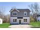 Two-story house with gray siding, a green door, and a paved driveway at 1823 Bristol Rd, Statesville, NC 28677