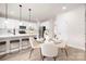 Open concept kitchen and dining area with white cabinets and island at 1823 Bristol Rd, Statesville, NC 28677