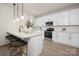 Modern kitchen with white cabinets, stainless steel appliances, and an island at 1823 Bristol Rd, Statesville, NC 28677