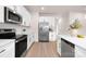 Bright kitchen featuring stainless steel appliances and white cabinetry at 1823 Bristol Rd, Statesville, NC 28677