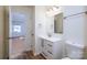 Clean bathroom with white vanity and a view into a bedroom at 2400 Caswell Ct, Gastonia, NC 28054