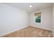 Bright bedroom with neutral walls and carpet at 2400 Caswell Ct, Gastonia, NC 28054