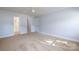 Spacious bedroom with neutral walls and carpeting at 2400 Caswell Ct, Gastonia, NC 28054