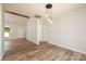 Dining area with hardwood floors and pendant lighting, adjacent to kitchen at 2400 Caswell Ct, Gastonia, NC 28054