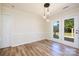 Bright dining room with hardwood floors and sliding glass doors leading to a deck at 2400 Caswell Ct, Gastonia, NC 28054