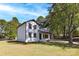 Two-story house with white siding, dark trim, and a covered porch at 2400 Caswell Ct, Gastonia, NC 28054