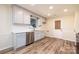 Renovated kitchen featuring gray cabinets, quartz countertops, and stainless steel appliances at 2400 Caswell Ct, Gastonia, NC 28054