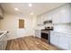 Modern kitchen with stainless steel appliances and gray cabinets at 2400 Caswell Ct, Gastonia, NC 28054