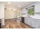 Renovated kitchen with gray cabinets, quartz countertops and stainless steel appliances at 2400 Caswell Ct, Gastonia, NC 28054